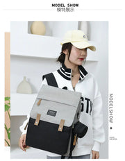 Mommy Backpack Multifunction Baby Diaper Bag being worn by a model, showcasing its modern design and functionality.