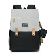 Stylish mommy backpack in gray and black, designed for multifunctional use as a diaper bag.