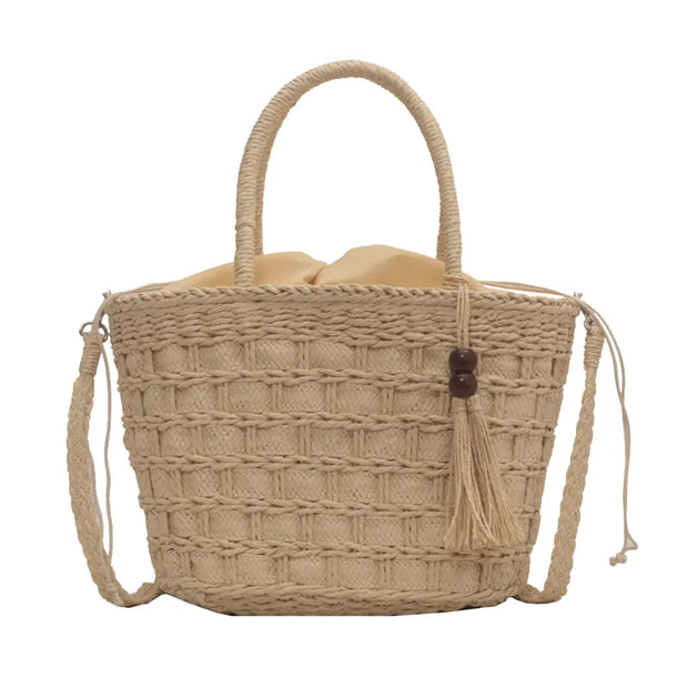Ladies Tassel Handbag-held Diagonal Dual-use Bag in brown straw with a stylish tassel detail.