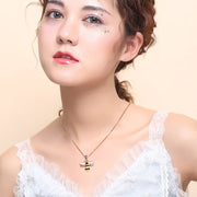 Bee Necklace featuring a gold bee pendant on a delicate collarbone chain